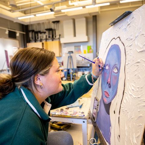 Student working on an art piece