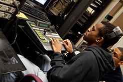 Student operates switchboard